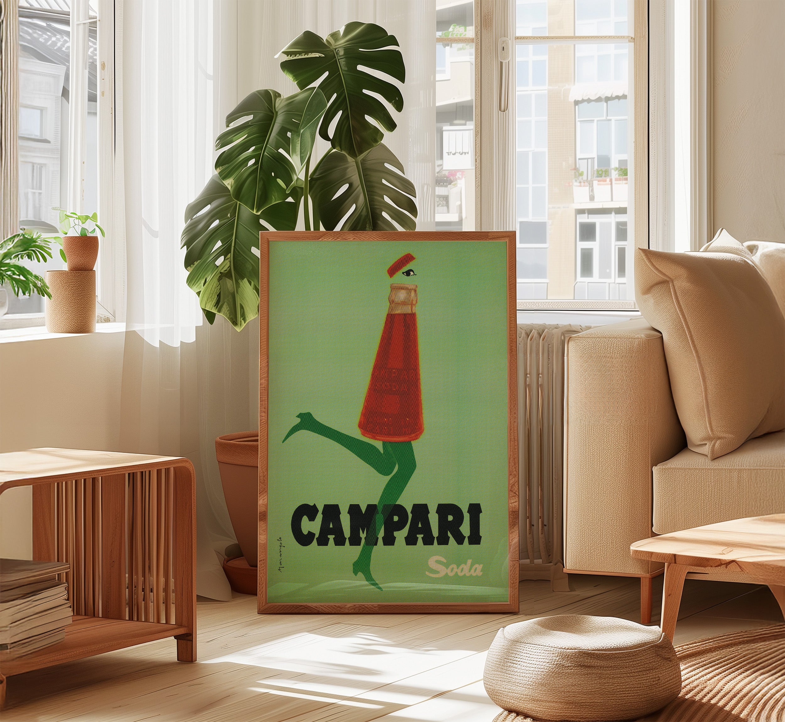 Campari Soda vintage advertising poster styled in a modern living room with natural light and indoor plants.