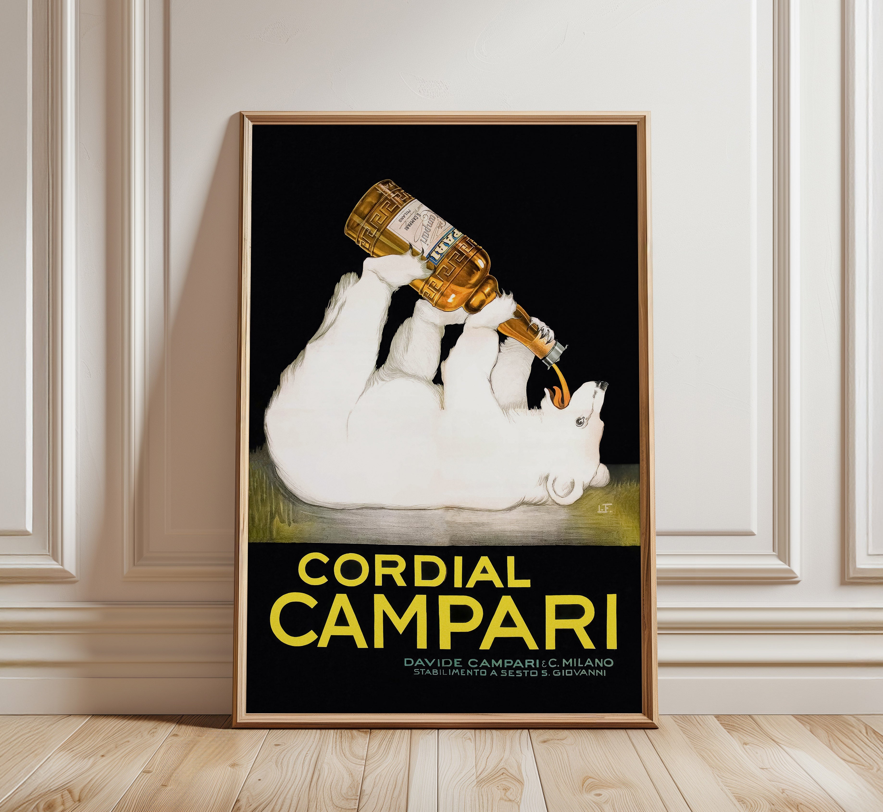 Cordial Campari vintage advertising poster by Franz Laskoff featuring a white polar bear drinking from an amber bottle against a black background.
