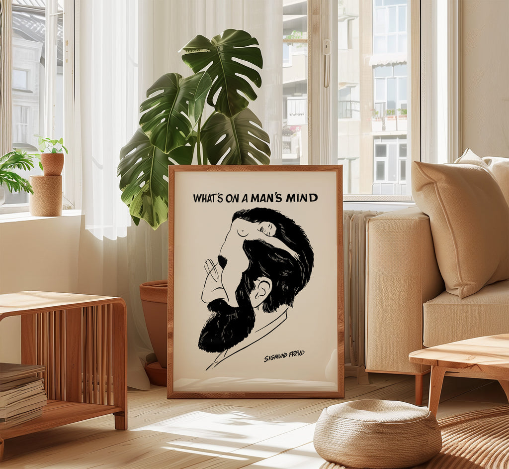 What’s on a Man’s Mind Freud poster displayed in a bright modern living room with warm wood furniture and natural light.