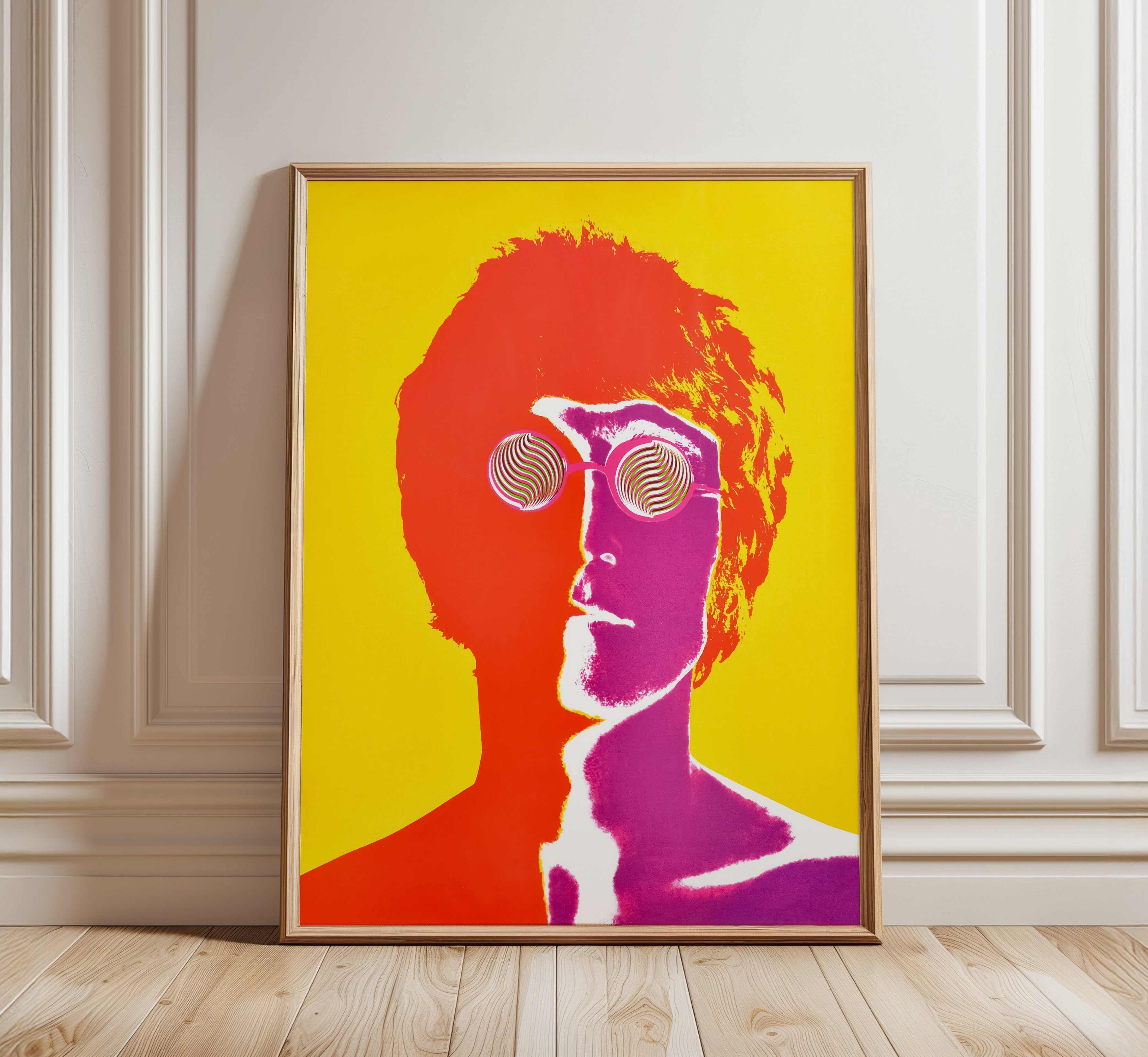John Lennon psychedelic portrait by Richard Avedon, 1967, displayed in a natural wood frame against a classic white interior.