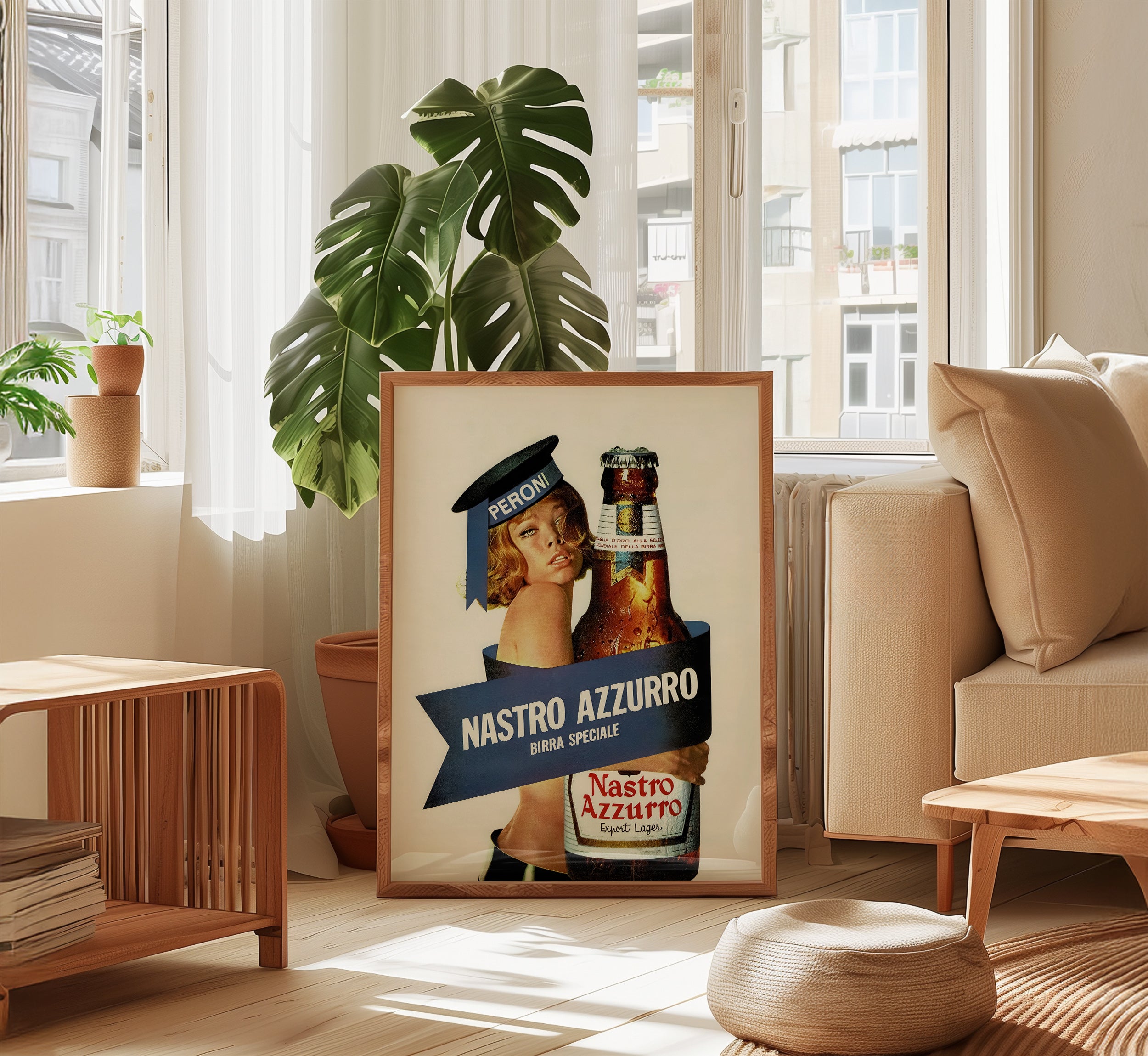Framed Nastro Azzurro vintage Italian beer poster displayed in a bright contemporary living room.