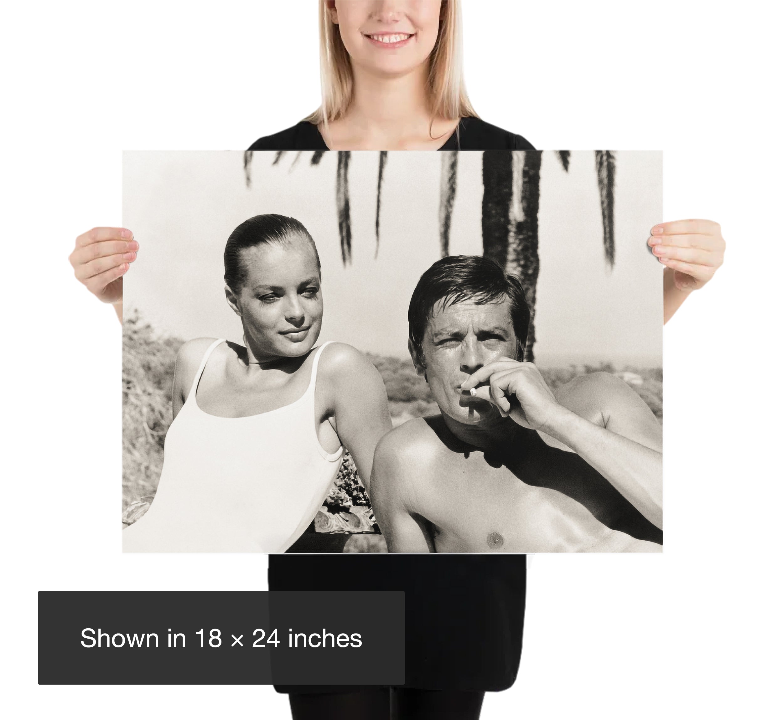 Woman holding an 18 by 24 inch black and white Romy Schneider and Alain Delon photography poster for scale