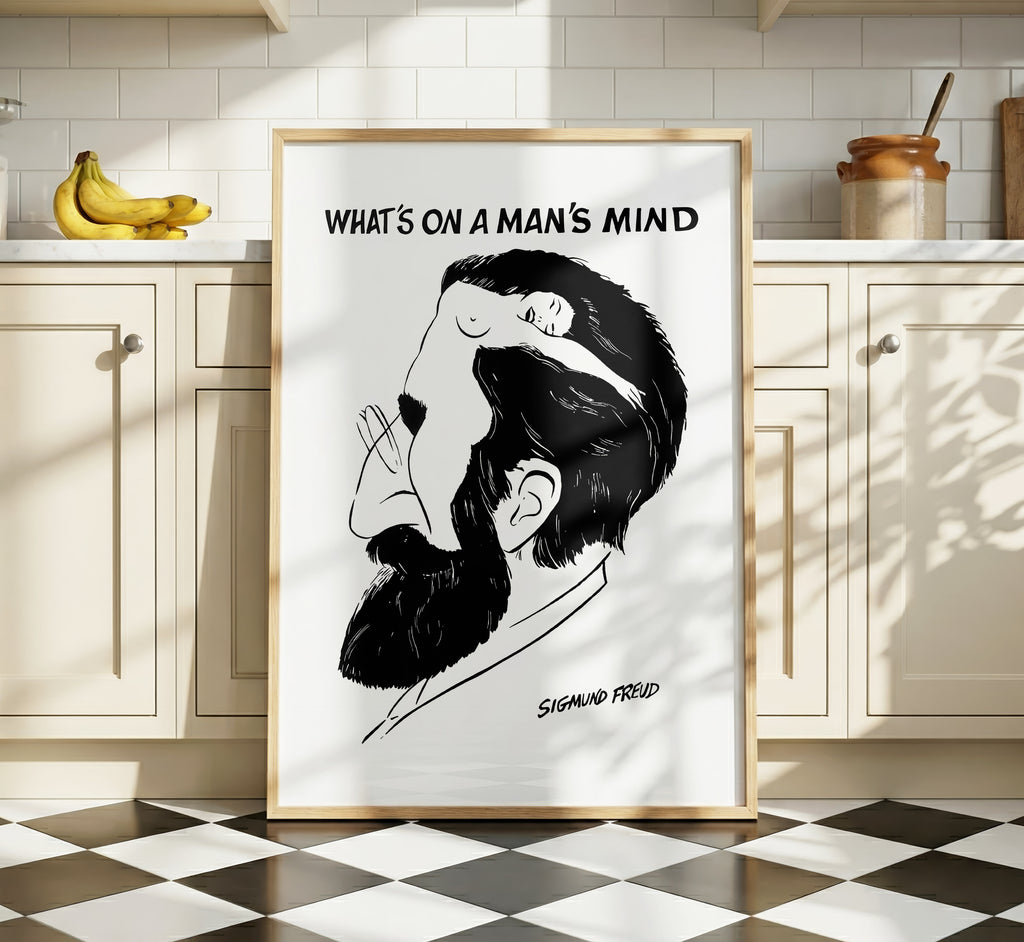What’s on a Man’s Mind Freud poster displayed in a bright kitchen interior, featuring a black-and-white optical illusion portrait.
